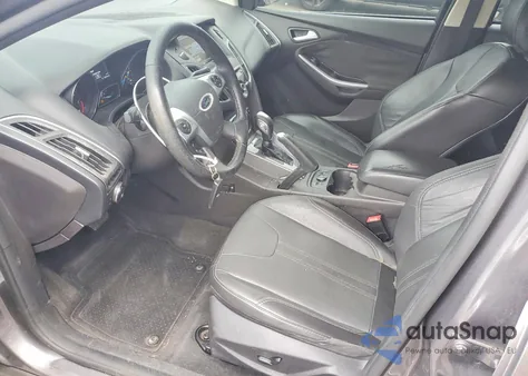 2014 Ford Focus Titanium z USA, uszkodzony, nr VIN 1FADP3N21EL261982